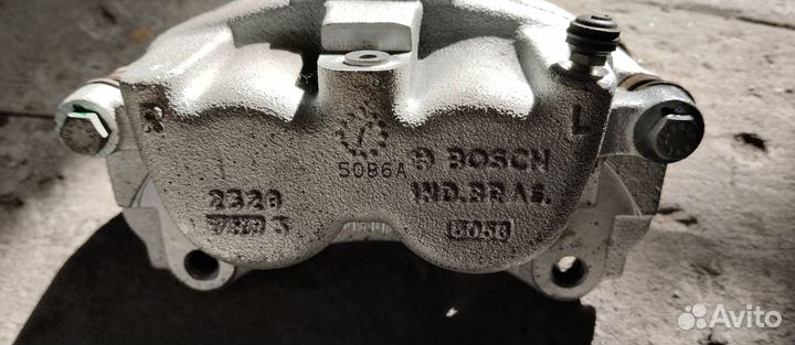 Суппорт тормозной левый Акрос 590/595