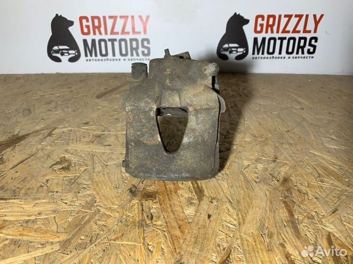 Суппорт тормозной передний левый Volkswagen Golf