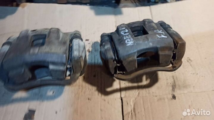 Суппорт тормозной левый Toyota corolla 120