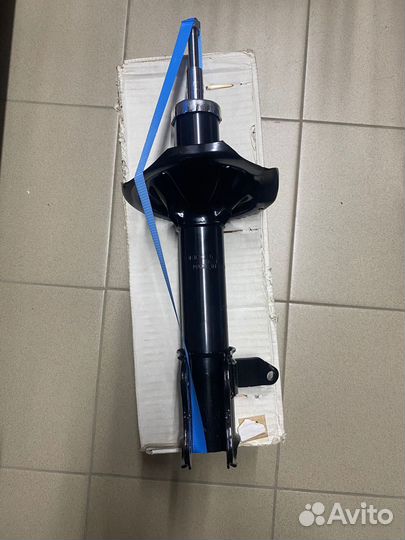 Амортизатор задний левый Mazda 323 BJ