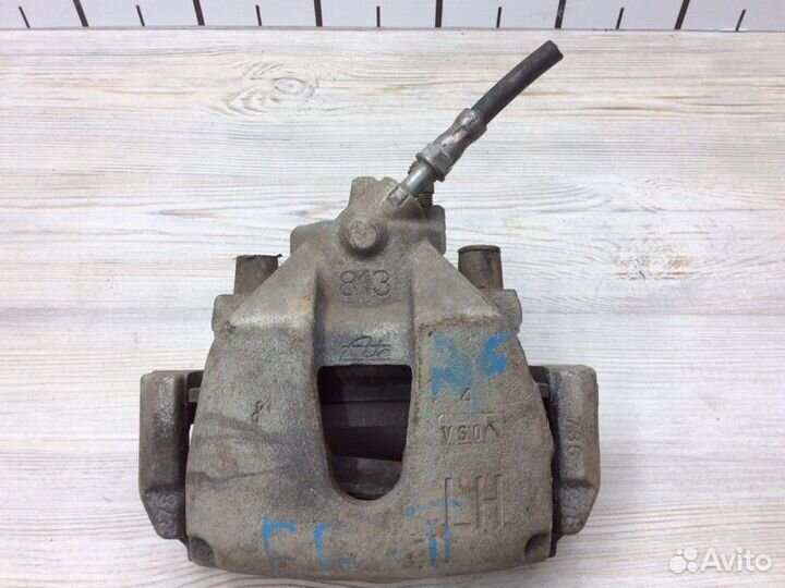 Суппорт тормозной передний левый Ford Focus 2