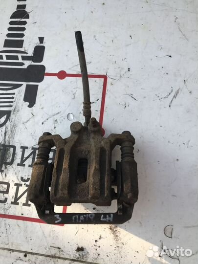 Суппорт тормозной задний левый Nissan Pathfinder