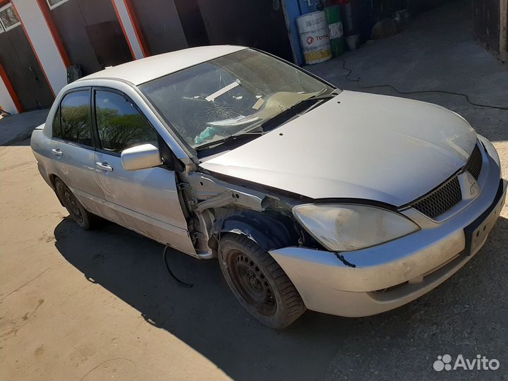 Митсубиси Лансер 9 компрессор кондиционера