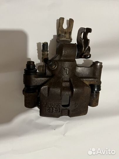 Суппорт задний левый мазда 626 gf