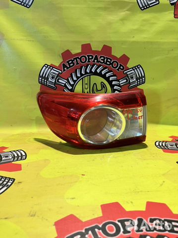 Фонарь левый наружний Toyota Corolla 150 рест