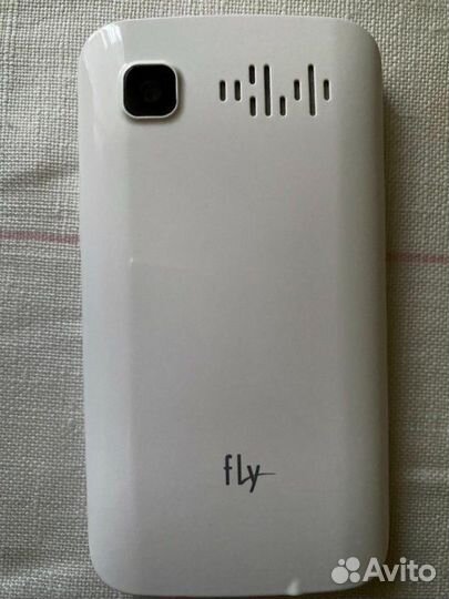 Телефон Fly с зарядкой в коробке