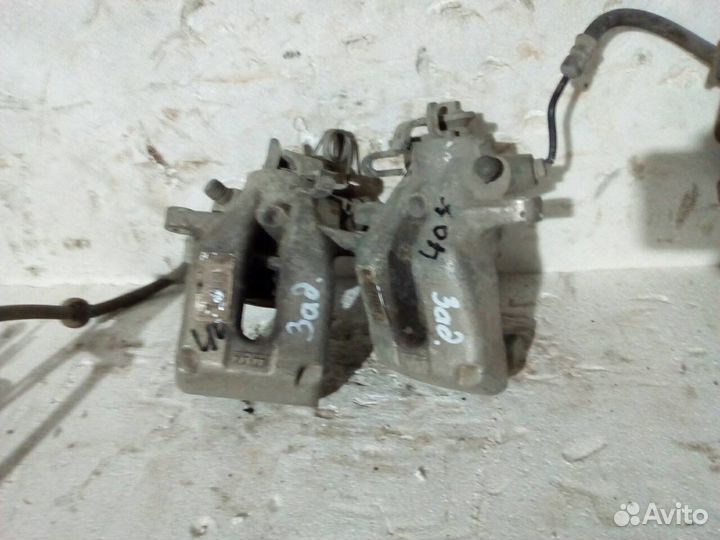 Суппорт тормозной задний Пежо 308 407