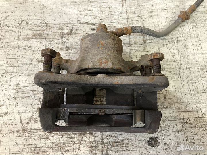 Суппорт передний тормозной Nissan Almera N15