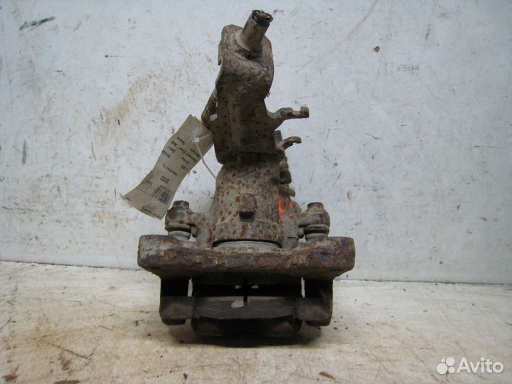 Суппорт задний Лев. Ниссан Альмера Тино 2003г 2.2л