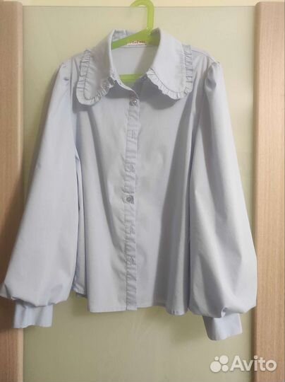 Блузка голубая