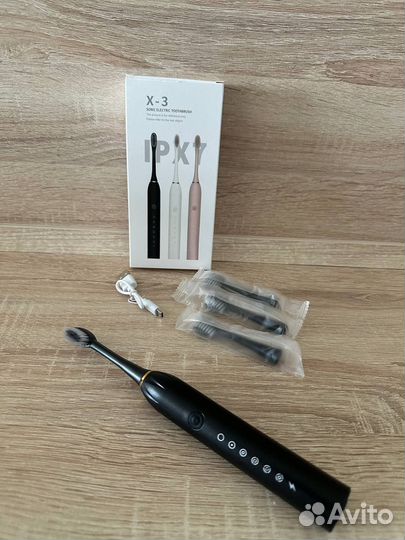 Электрическая зубная щетка