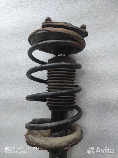 Стойка передняя левая Nissan Almera N15