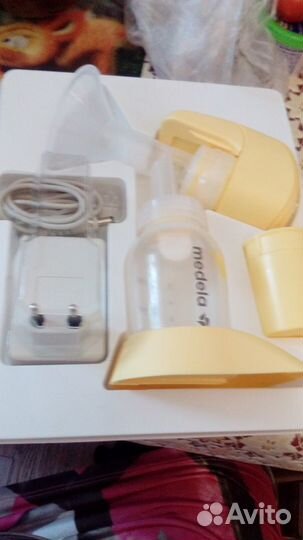 Молокоотсос medela электрический