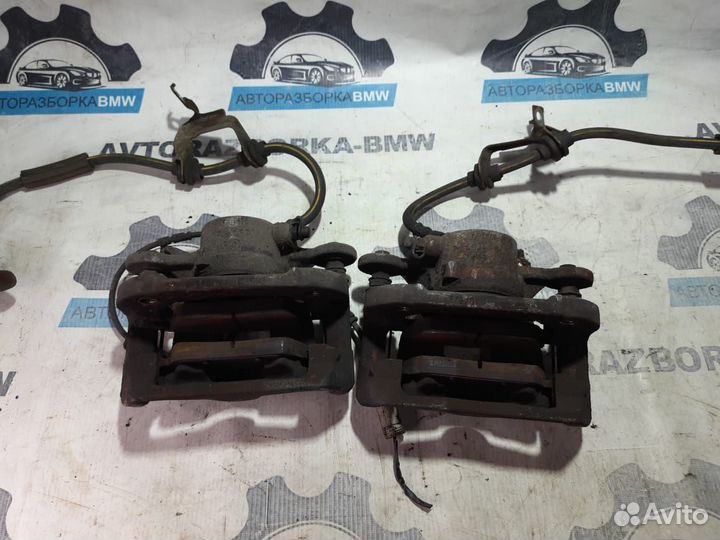 Суппорт тормозной передний левый правый BMW 1-сери