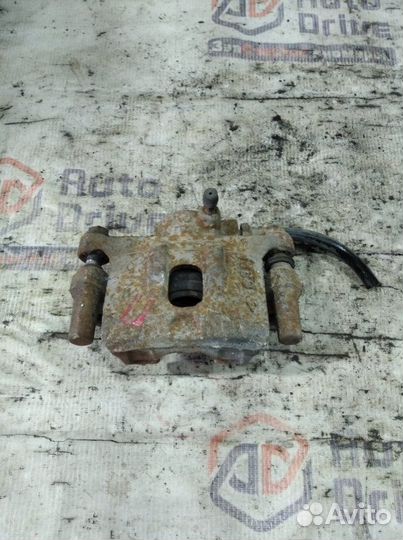 Суппорт тормозной задний правый Mitsubishi Lancer