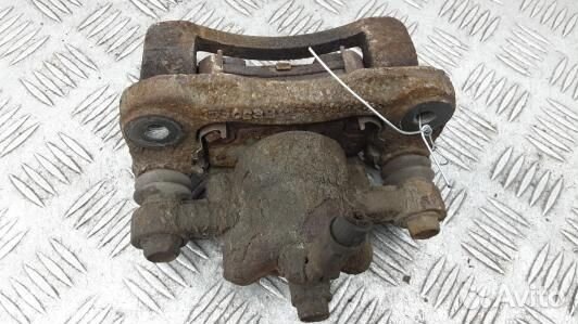 Суппорт тормозной задний левый KIA RIO 2 (XBN17LS0