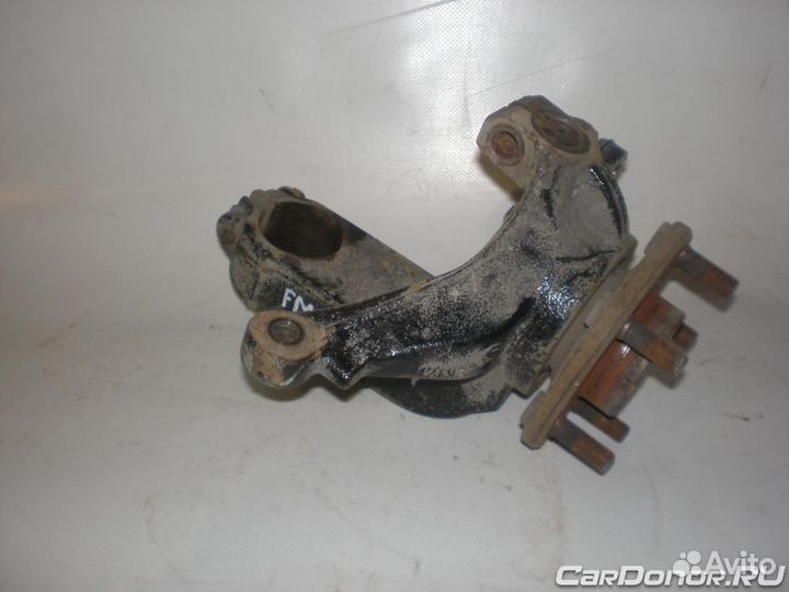 Кулак поворотный в сборе передний левый (цапфа) б