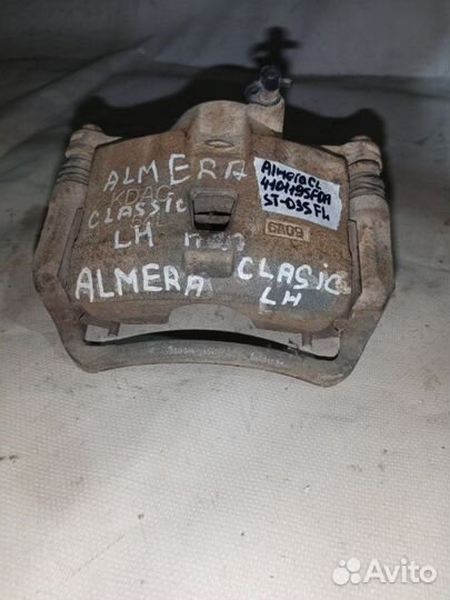 Суппорт тормозной передний левый Nissan Almera