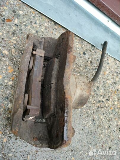 Суппорт тормозной передний левый Kia Spectra S6D