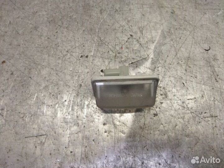 Фонарь подсветки номера левый Toyota Corolla E12