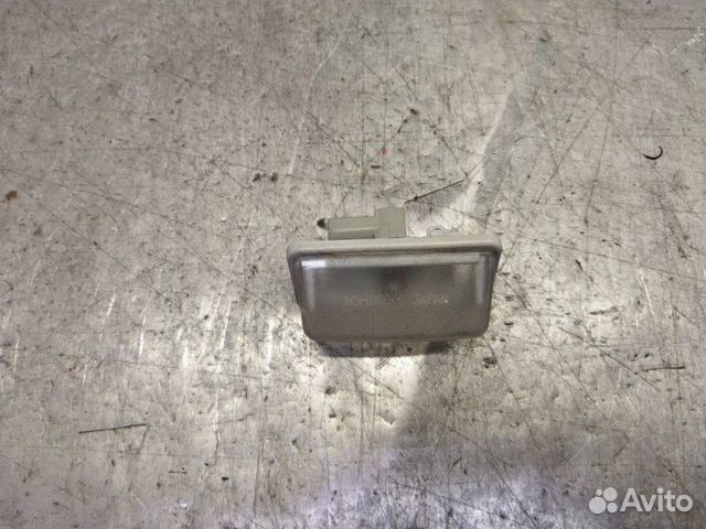 Фонарь подсветки номера левый Toyota Corolla E12