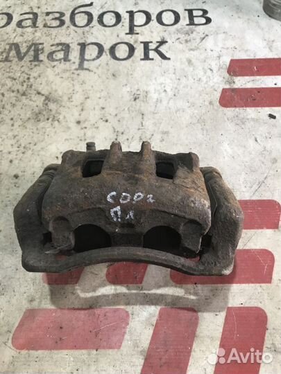 Суппорт тормозной передний левый Kia Sorento II (2