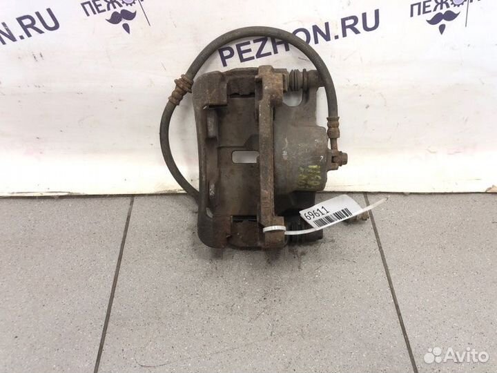 Суппорт тормозной передний левый Nissan Qashqai