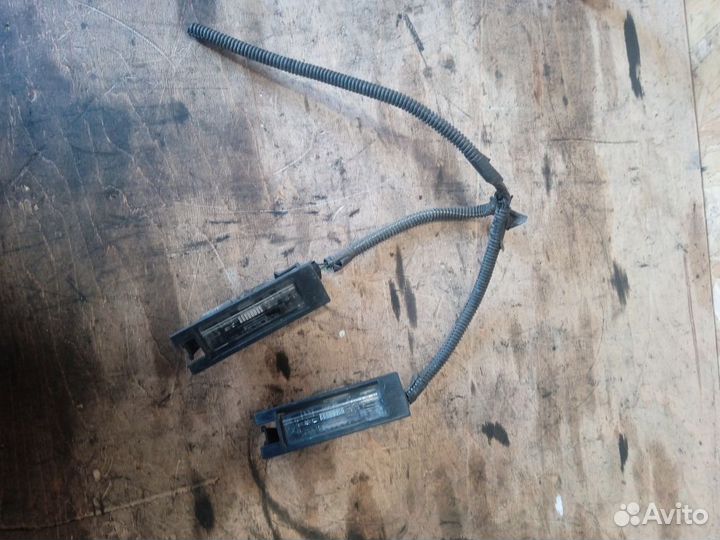 Фонарь подсветки заднего номера Opel Corsa D