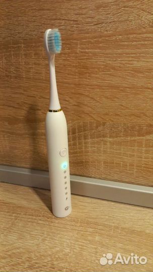 Электрическая зубная щетка новая