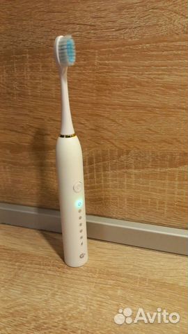 Электрическая зубная щетка новая