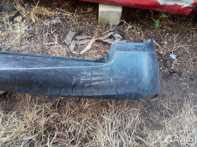 Бампер задний Kia Carnival 1999-2006