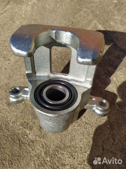 Суппорт тормозной задний левый Ниссан Х-трейлТ-31