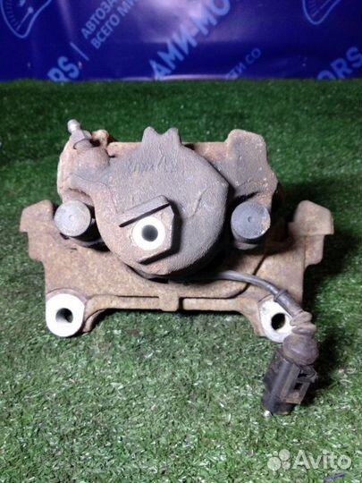 Суппорт тормозной передний левый Volkswagen Tiguan