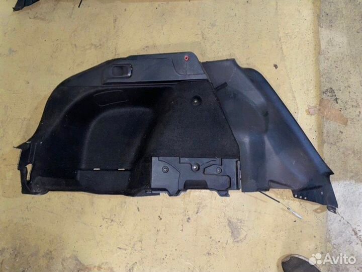 Обшивка багажника задняя левая Mitsubishi Lancer X