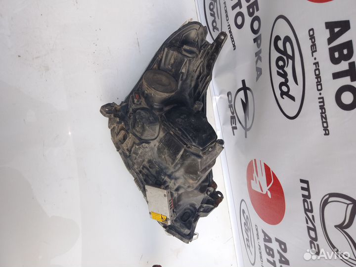 Фара левая Opel Astra H