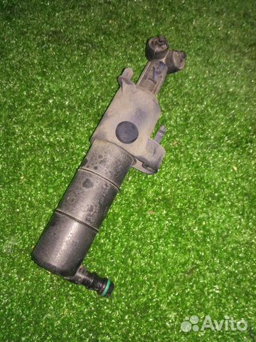 Форсунка омывателя фар передняя левая