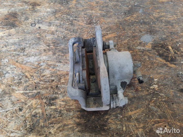 Суппорт тормозной передний правый Kia Sportage KM