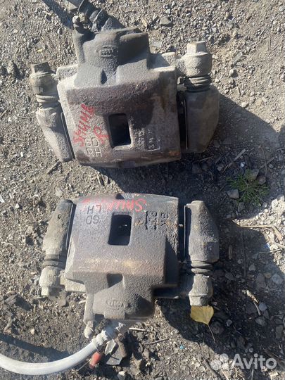 Суппорт тормозной передний kia spectra