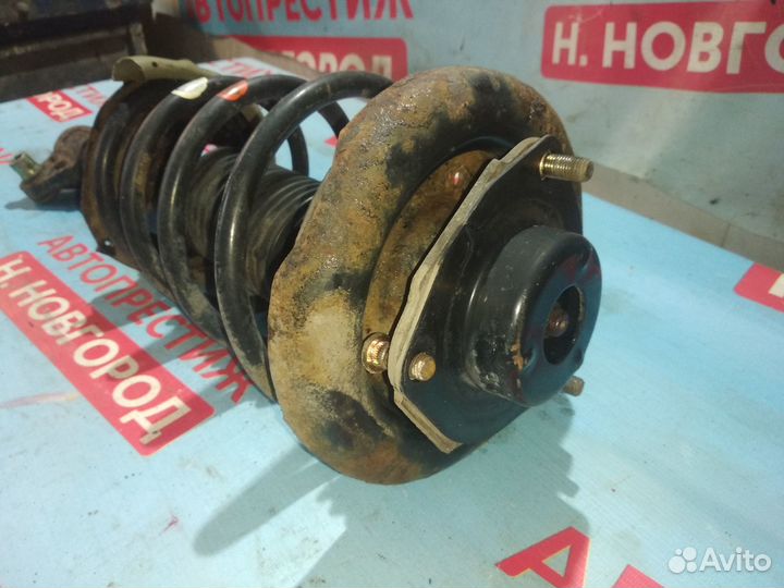 Стойка передняя левая Ниссан Премьера P12