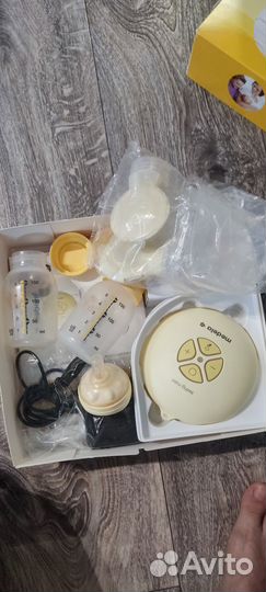 Молокоотсос medela электрический