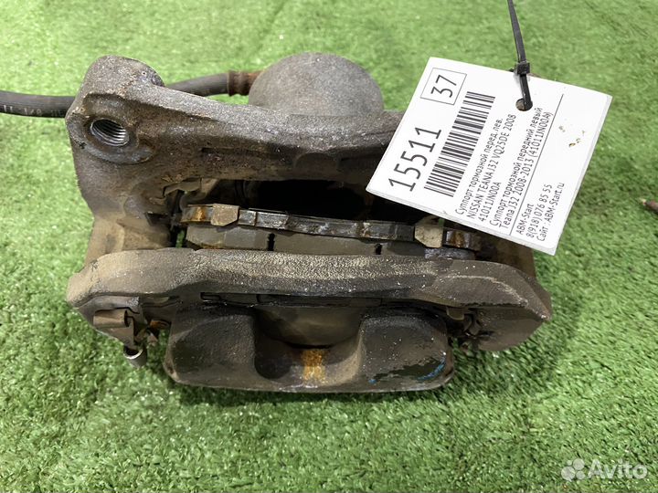 Суппорт тормозной передний левый Nissan Teana J32