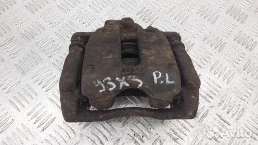 Суппорт тормозной передний левый nissan note E11