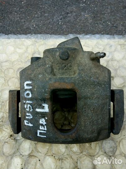 Суппорт тормозной перед лево Ford Fusion