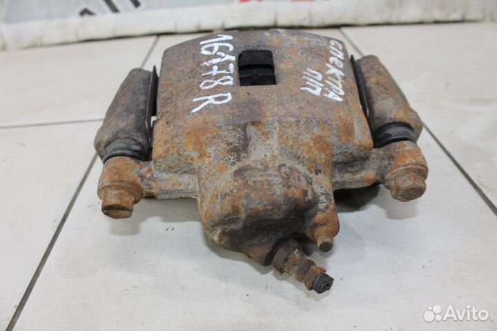 Суппорт тормозной Киа Спектра