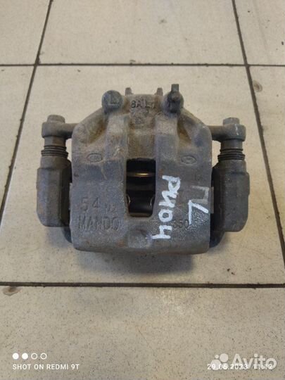 Суппорт тормозной передний левый Kia Rio 4