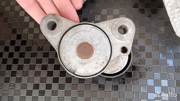 Опорные ролики/натяжитель ремня лансер 10