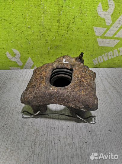 Суппорт передний левый Киа Сепия Шума 96-01