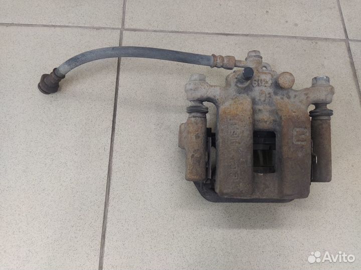 Тормозной суппорт задний левый Ниссан Кашкай J10