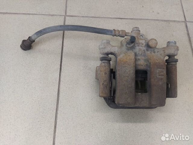 Тормозной суппорт задний левый Ниссан Кашкай J10