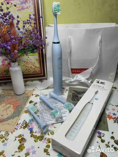Электрическая зубная щетка